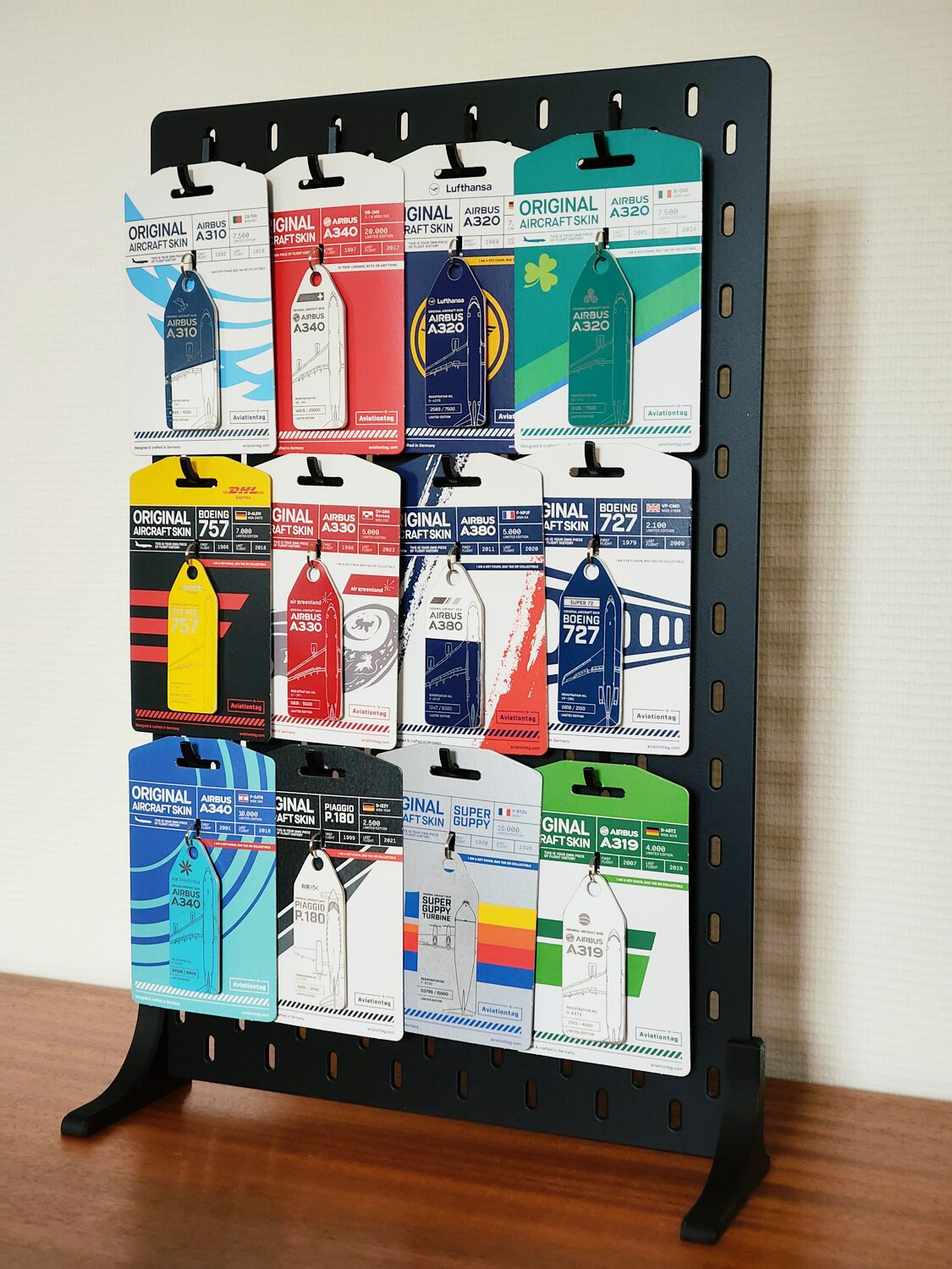 I bought a Skådis pegboard from IKEA, 3D printed feet and hooks, and now I can have my modest collection of Aviationtags on display. It's actually only half of all the Aviationtags I have. I use the rest as luggage tags.