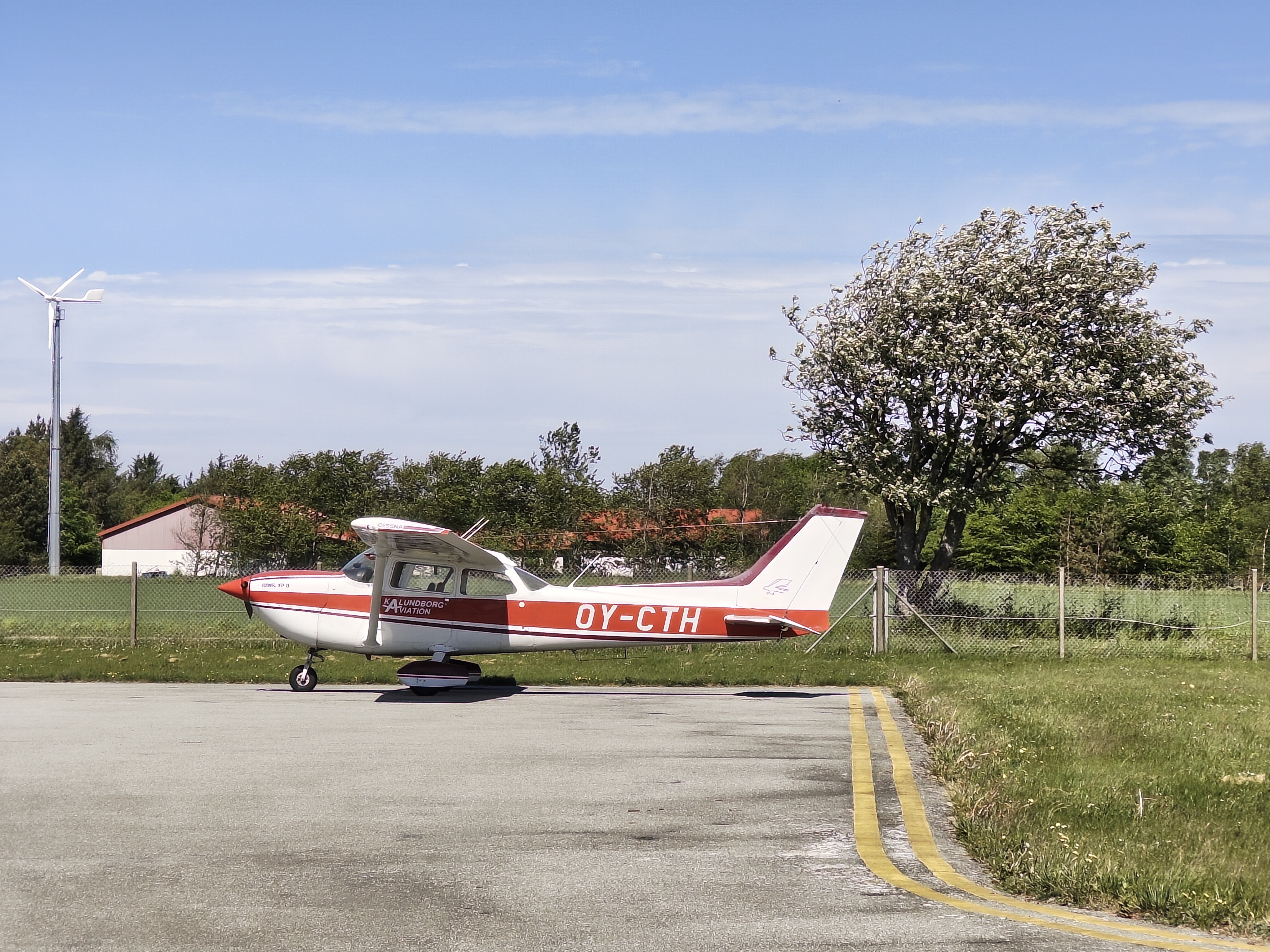 Cessna R172K Hawk XP II in CNL on a sunny but rather windy day.