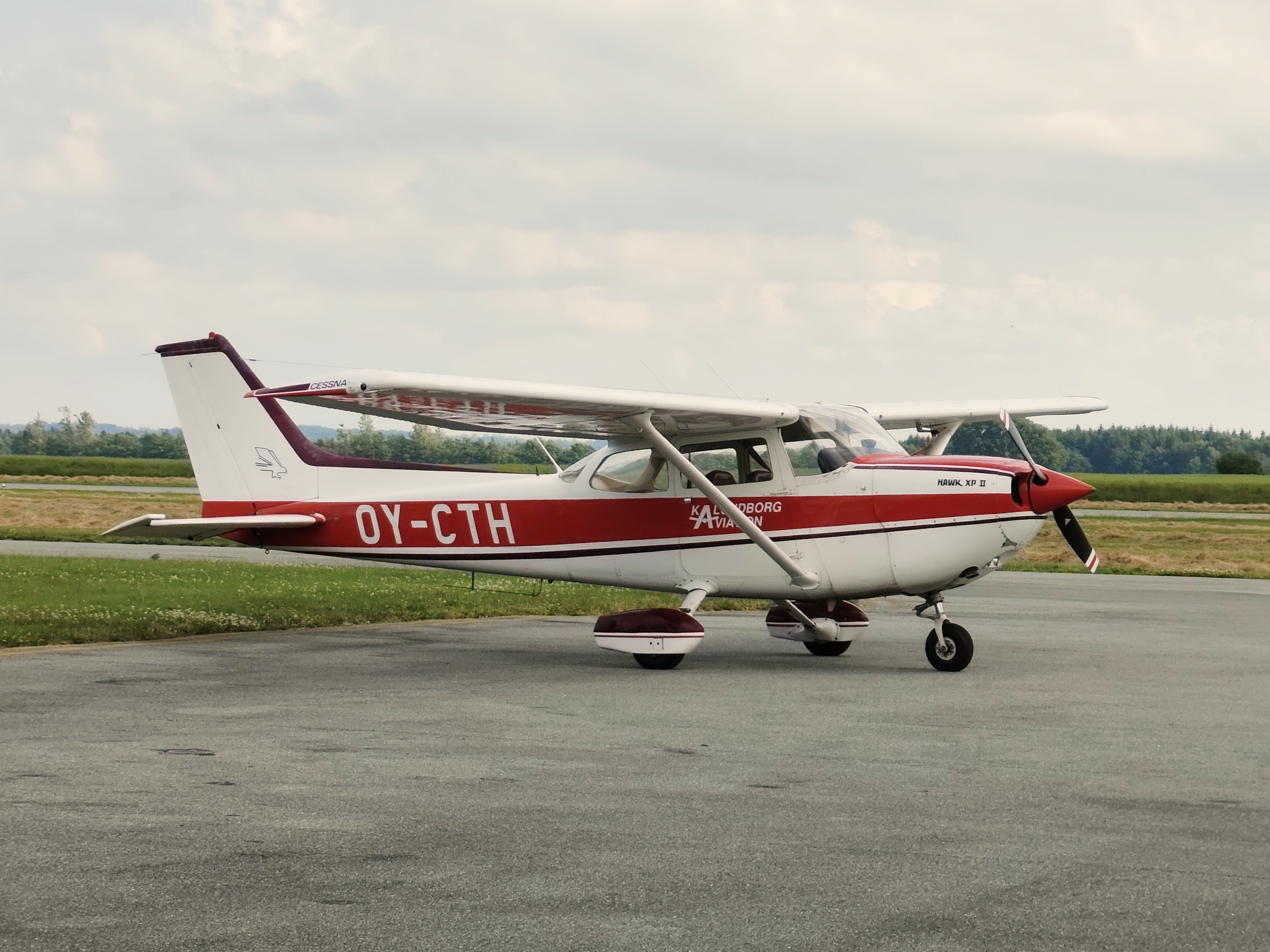 I missed the open house at EKSN today because I wasn't feeling well, but I took an enjoyable bike ride to the airport instead. It was delightfully quiet and calm there, and a single airplane was parked on the apron.